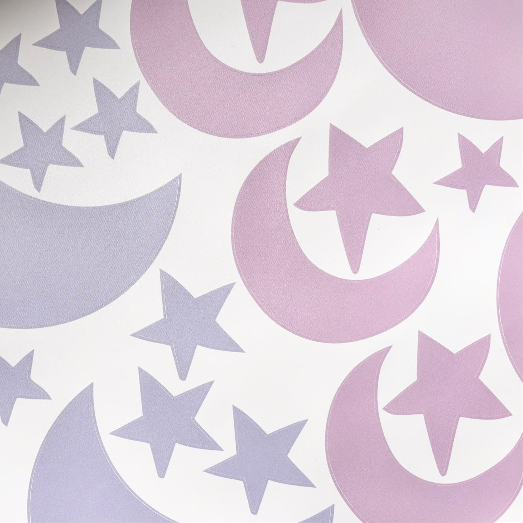 Pattern of purple stars and crescent moons on a white background