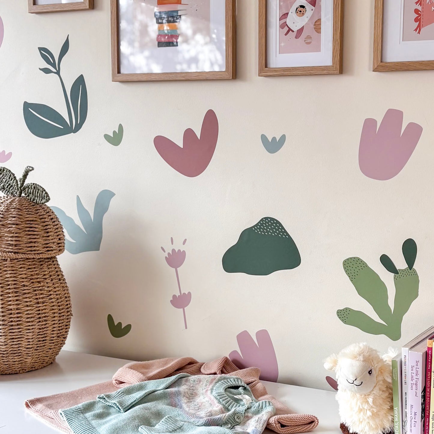 Children's room with decorative wall stickers, a wicker basket, and soft toys.