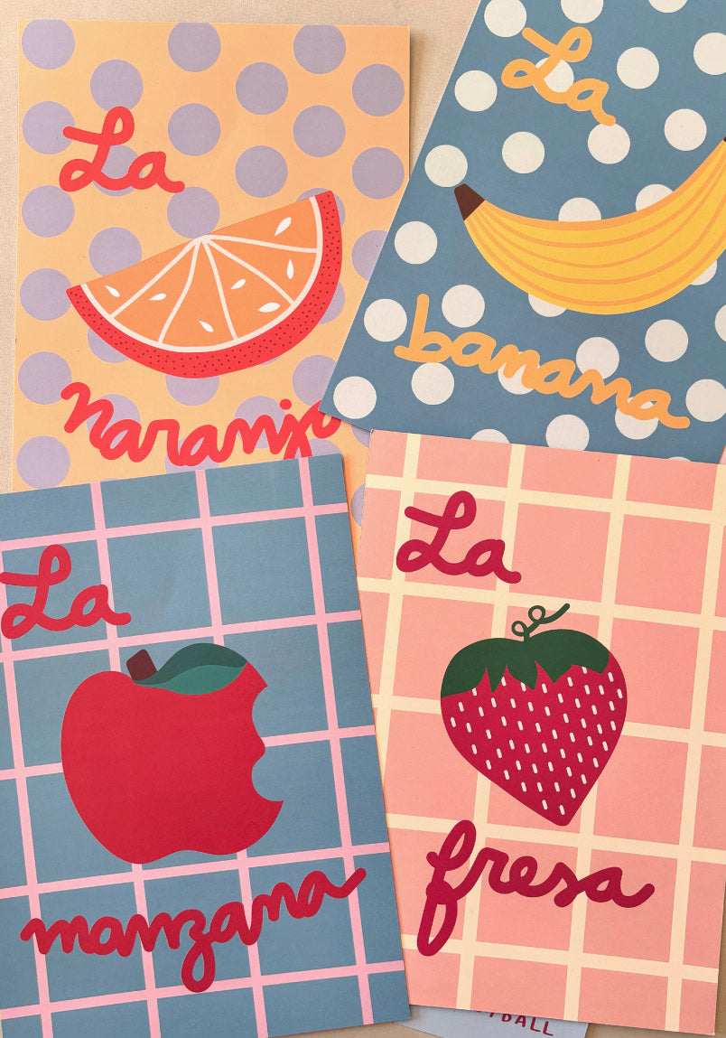 Four colorful prints with fruit illustrations and text on a polka dot and checkered background.